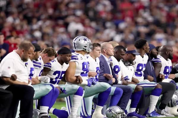 Dallas Cowboys players kneeling