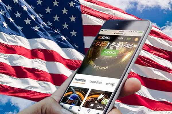 Mobile Sports Betting on a smartphone in front of a US Flag