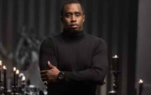 Diddy in a black turtleneck crossing his arms